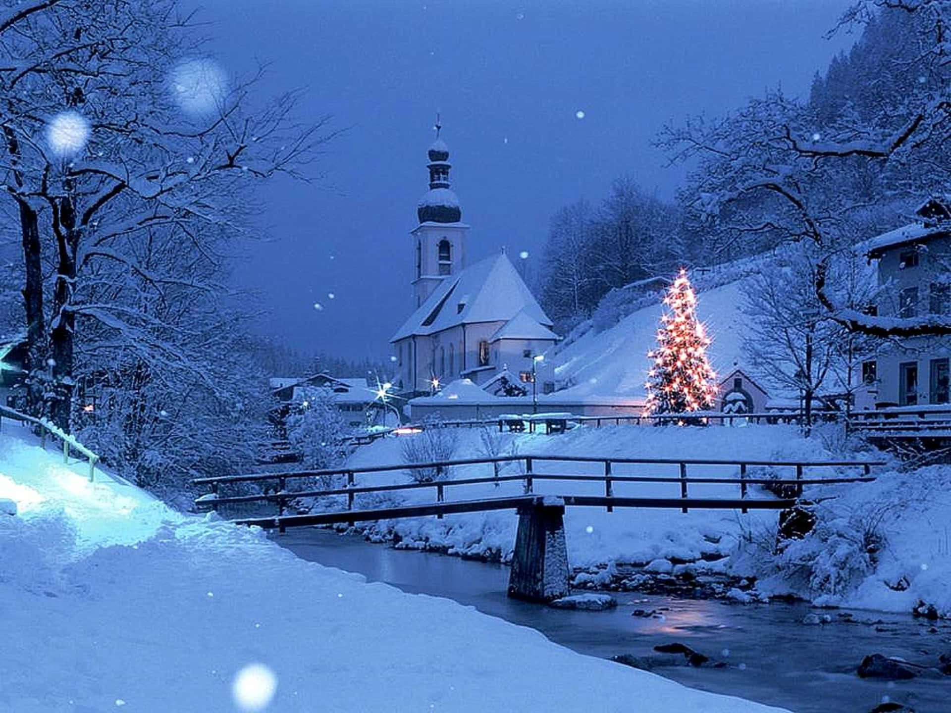 Enchanting Snowy Village in Winter Wonderland Wallpaper