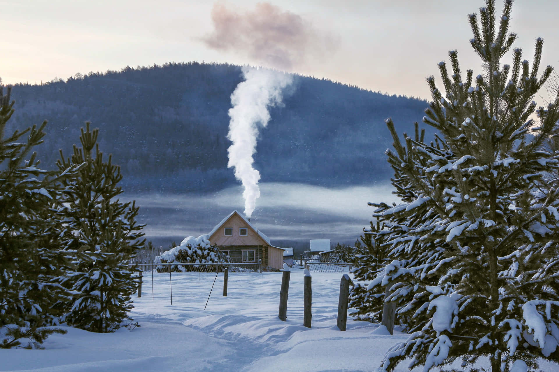 Enchanting Snowy Village at Winter Dusk Wallpaper