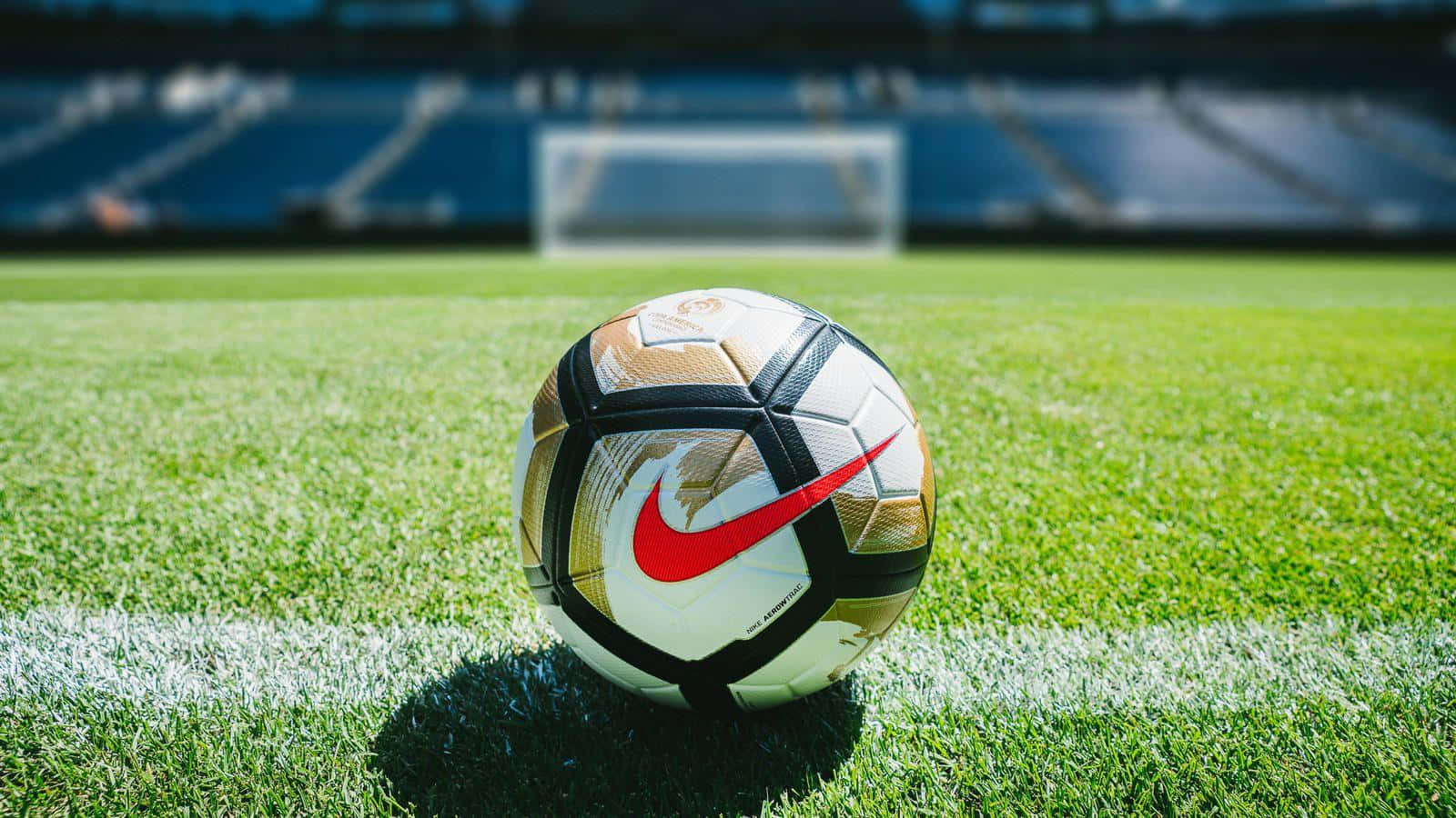 Fondode Pantalla De Balón De Fútbol Con Logotipo De Nike En Rojo.