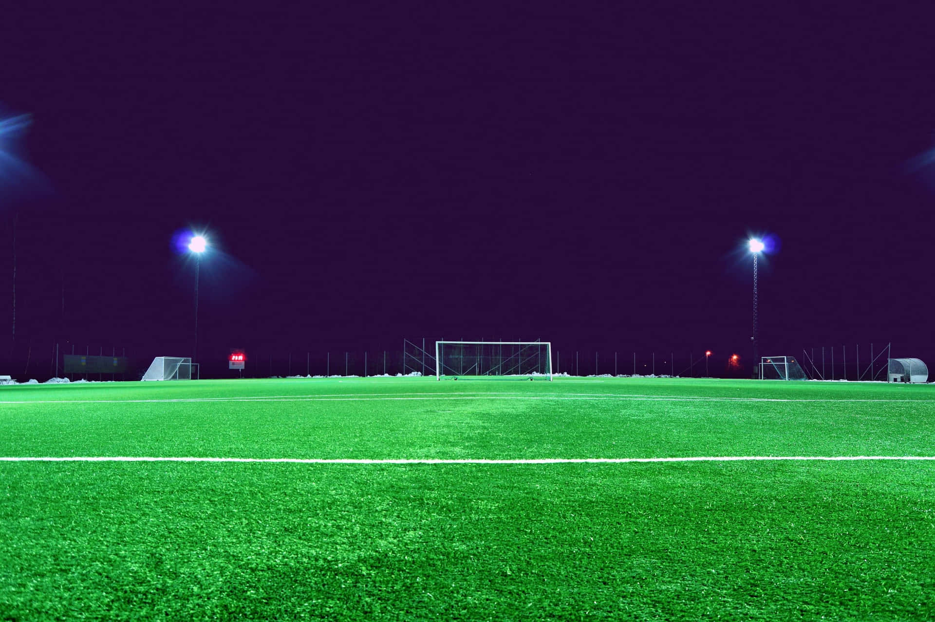 Green And Grassy Soccer Field Background