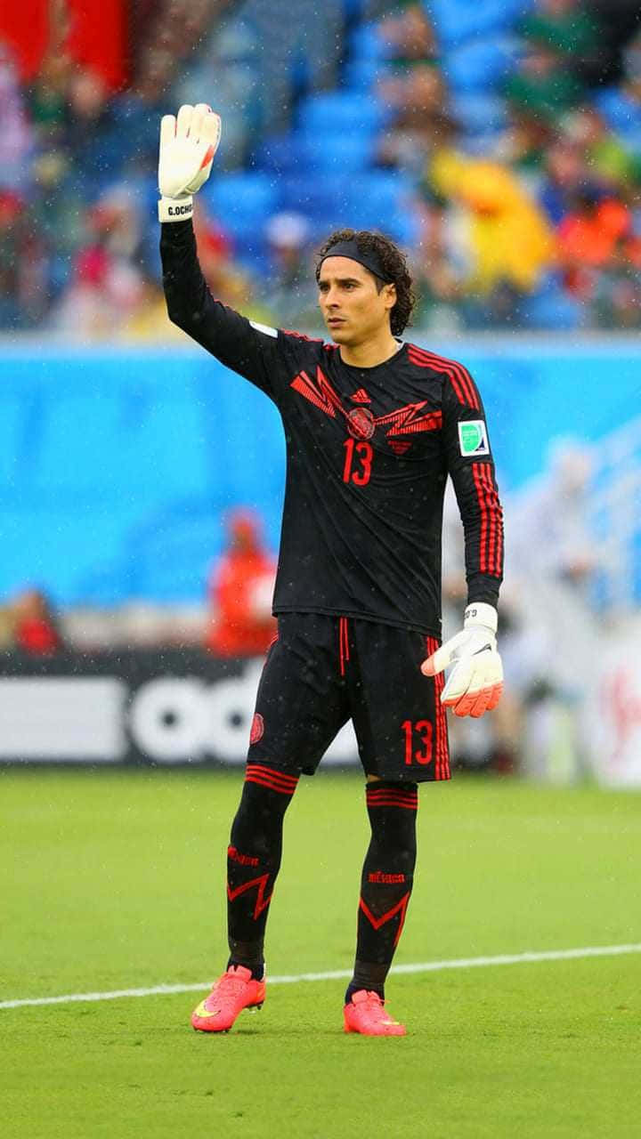 Soccer Goalkeeper Raising Hand Wallpaper