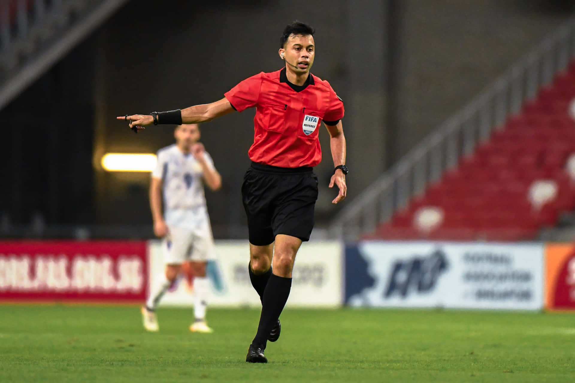 Soccer Referee In Action During Match.jpg Wallpaper