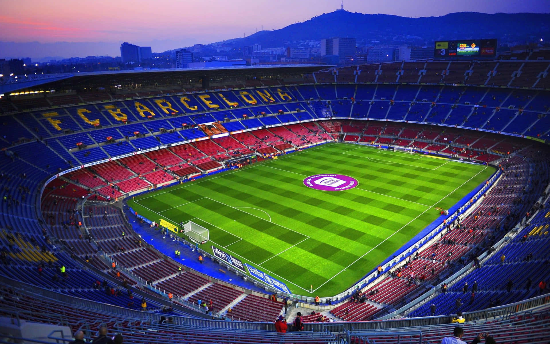 Barcelona Fc Stadium At Dusk Wallpaper