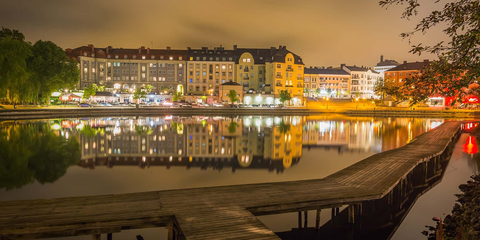 Sodertalje Nighttime Waterfront Reflections Wallpaper
