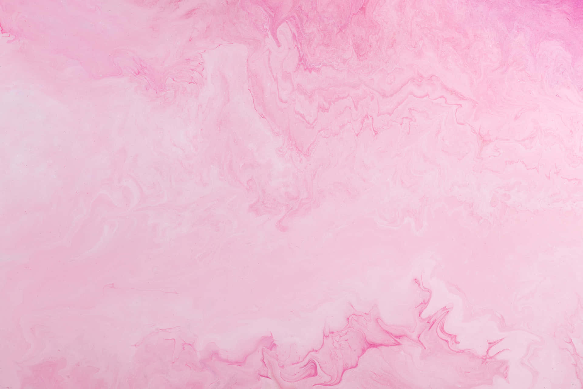 Soft pink background with a hint of subtle texture