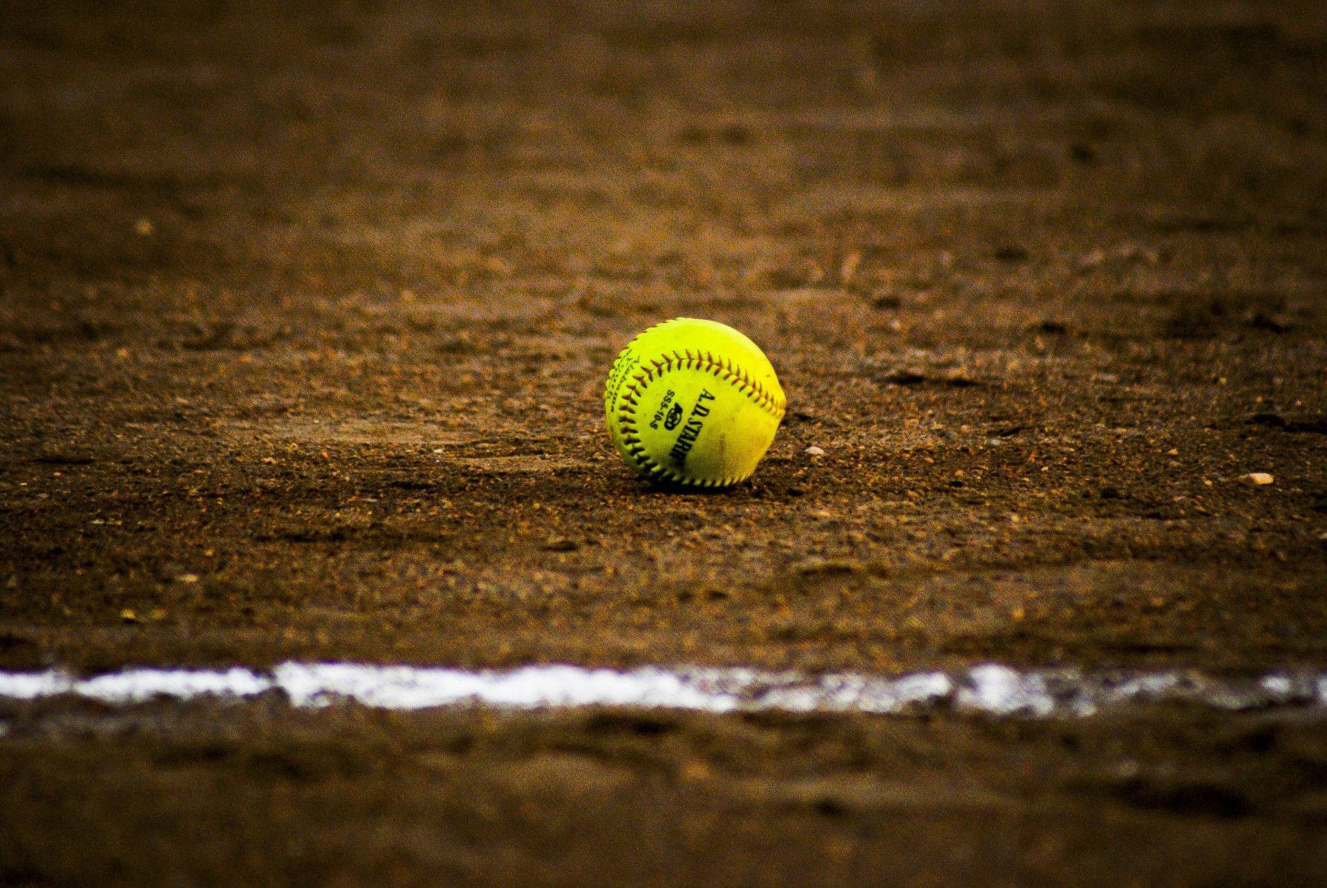 Softball In The Middle Of Field Wallpaper