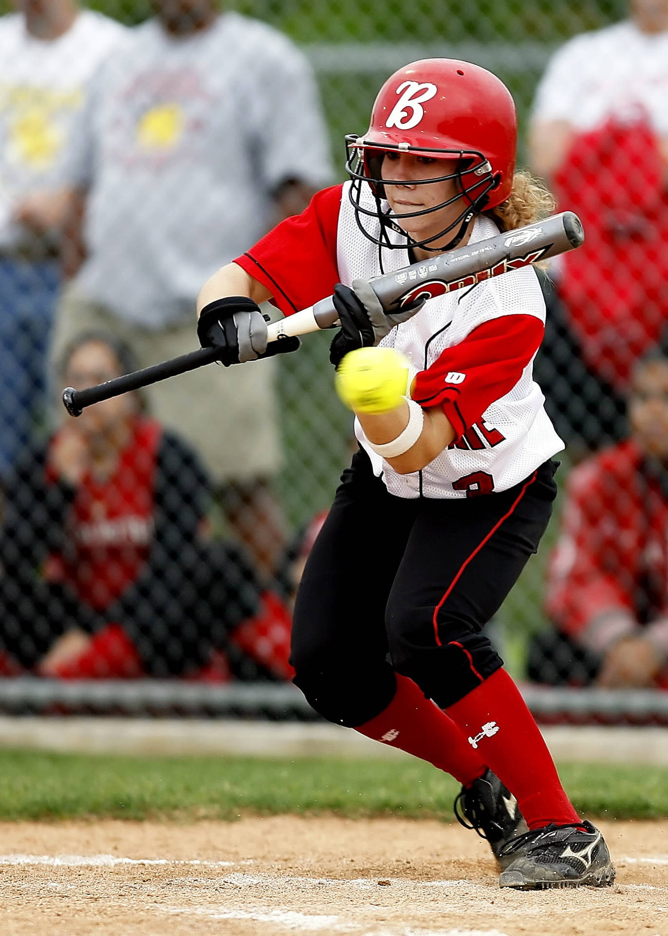 Softball Player With Fast Moving Ball Wallpaper