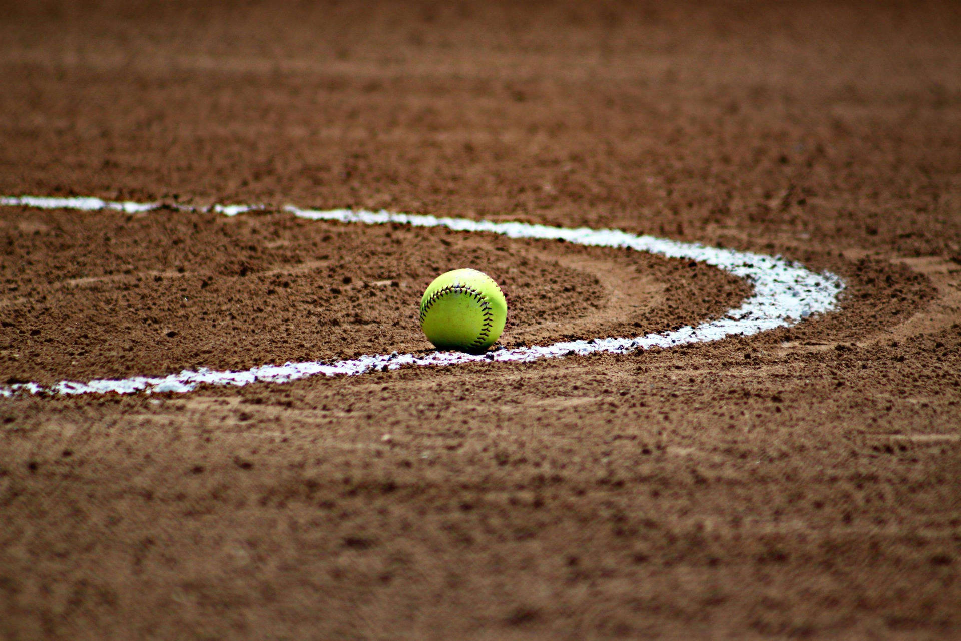 Softball Surrounded By White Curved Line Wallpaper