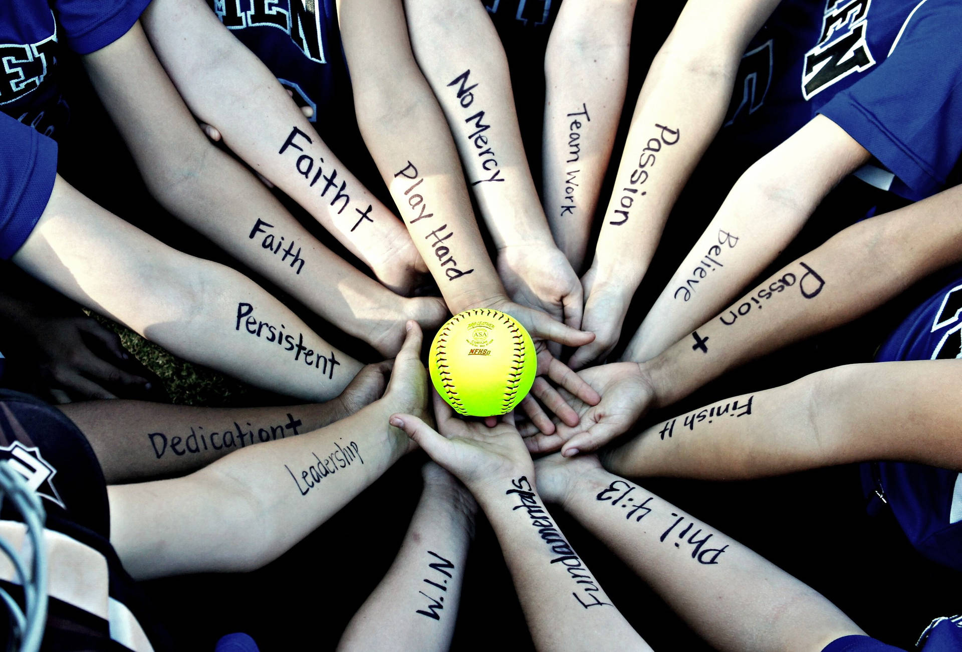 Softball Team Arms With Black Text Wallpaper