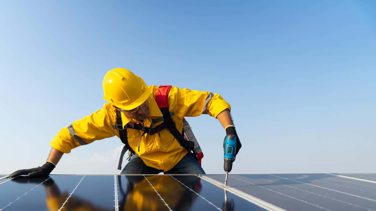 Solar Panel Installation Worker Action Wallpaper