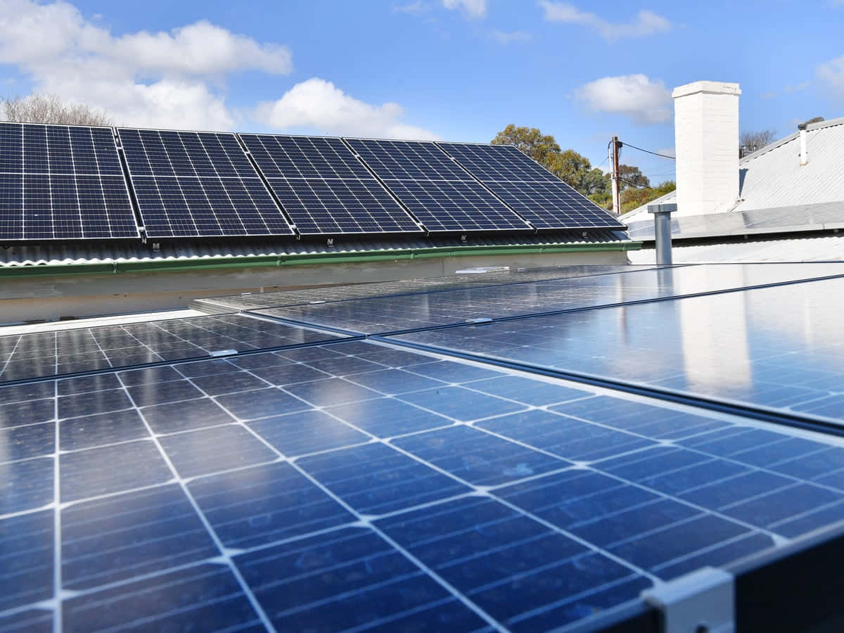 Solar Panels On A House Roof In Australia Wallpaper