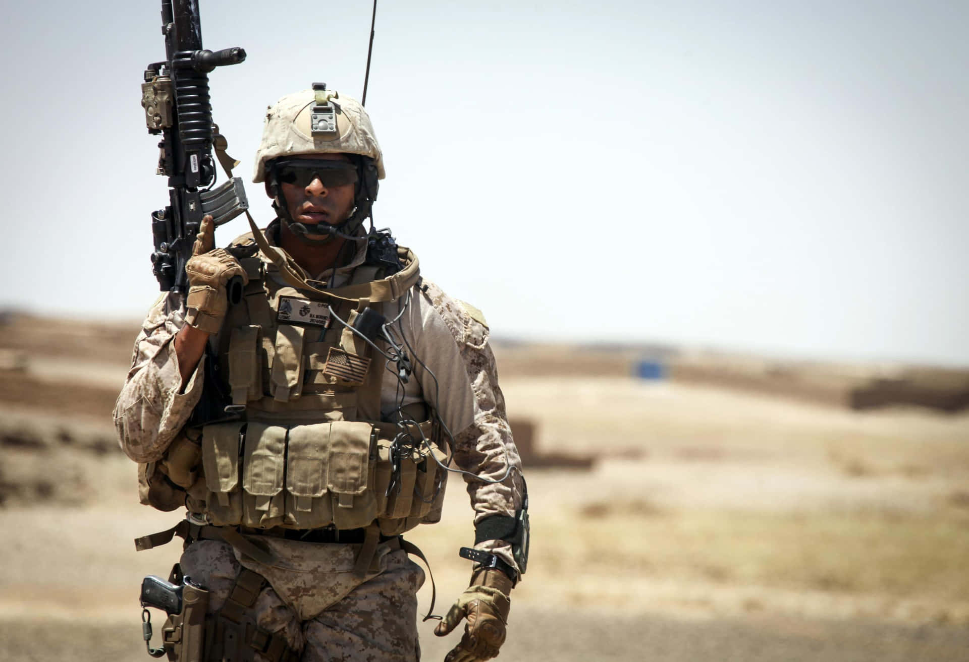 Soldier Uniform Holding Up Gun Wallpaper