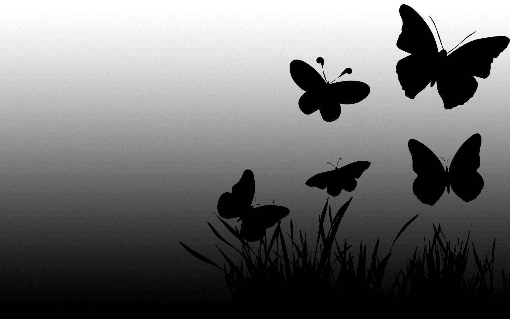 Solid Black Butterfly Graphics With Grass Wallpaper