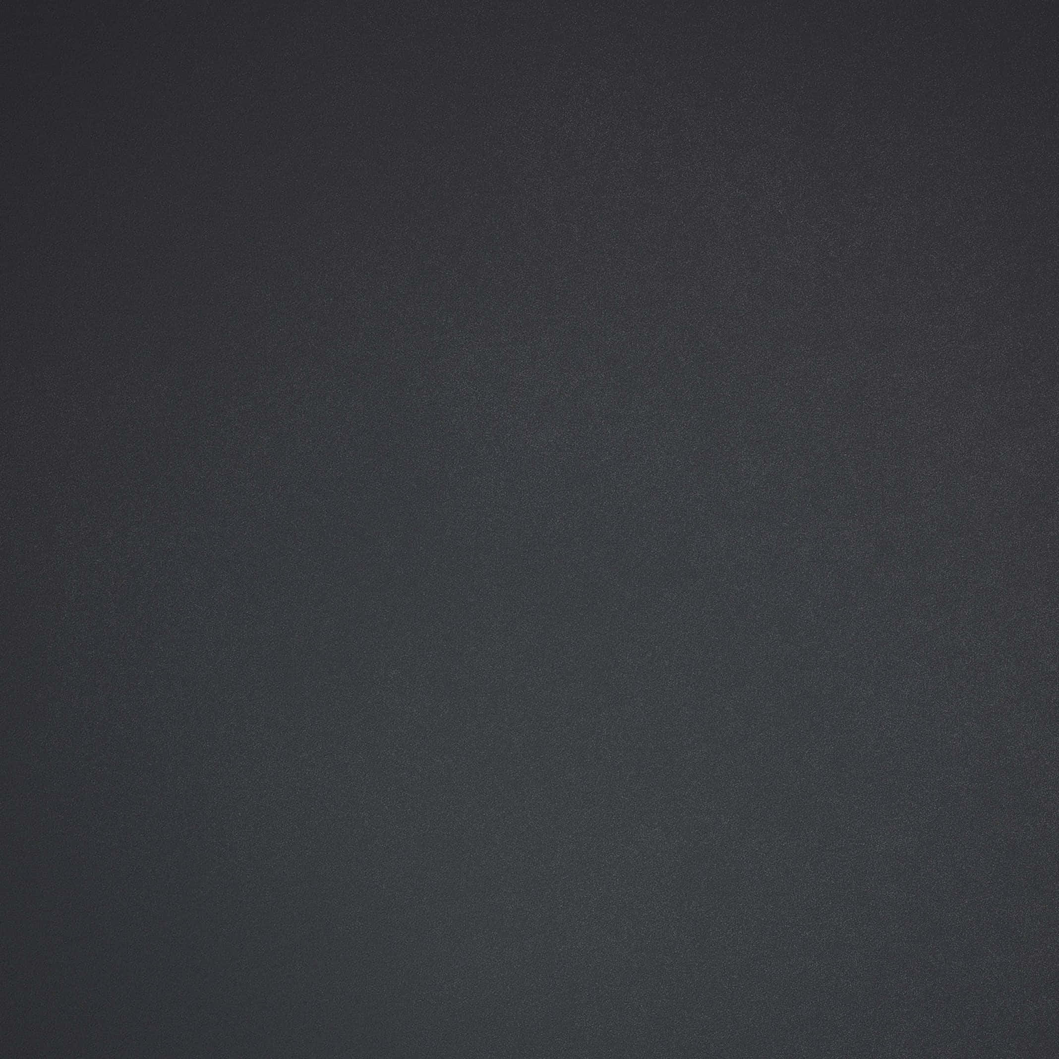 Solid Grey Background — A close-up of a smooth dark charcoal gray fabric with subtle texture and even lighting.
