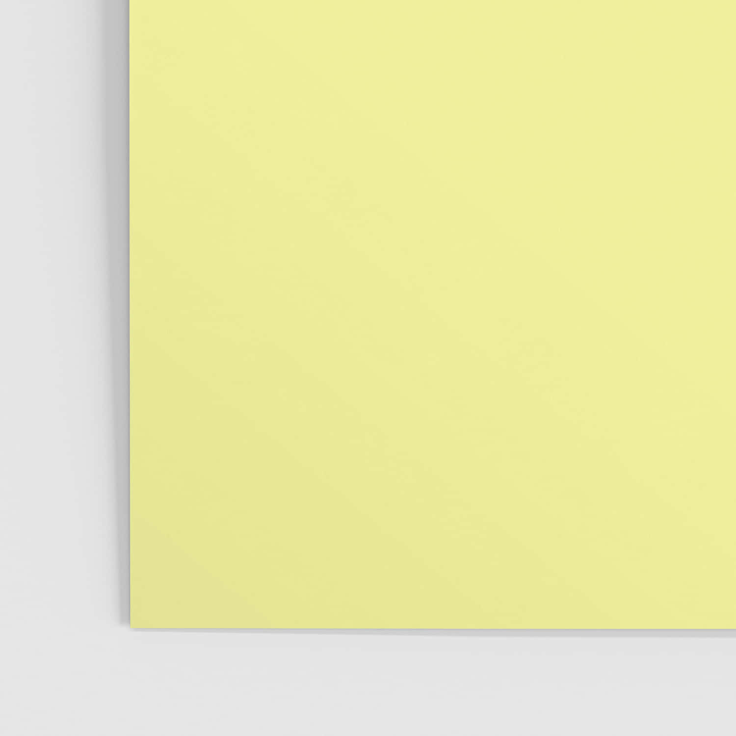 A Yellow Notepad On A White Background