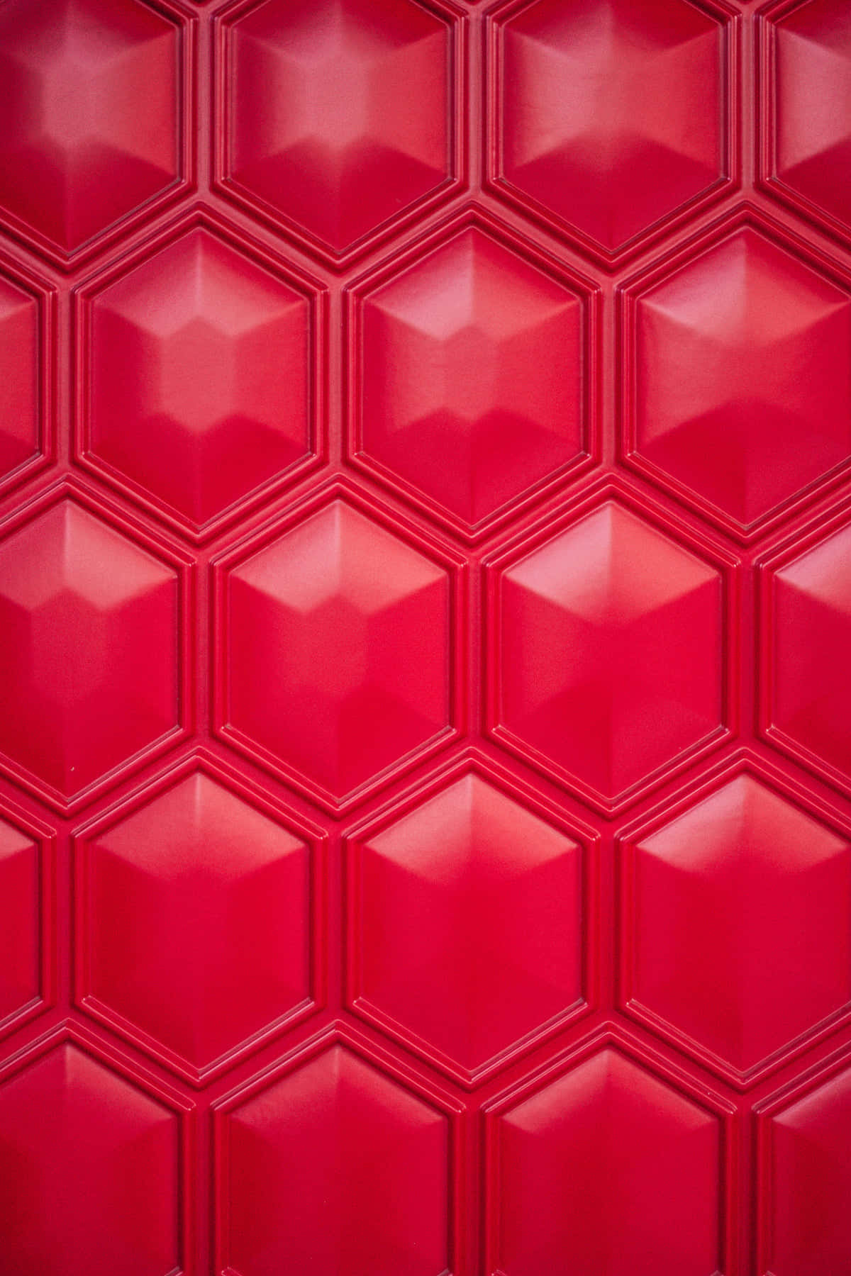 Rödhexagonal Brickvägg Bakgrund. Wallpaper