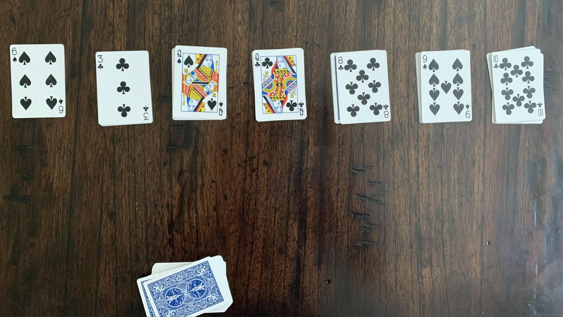 Solitaire On A Wooden Table Wallpaper