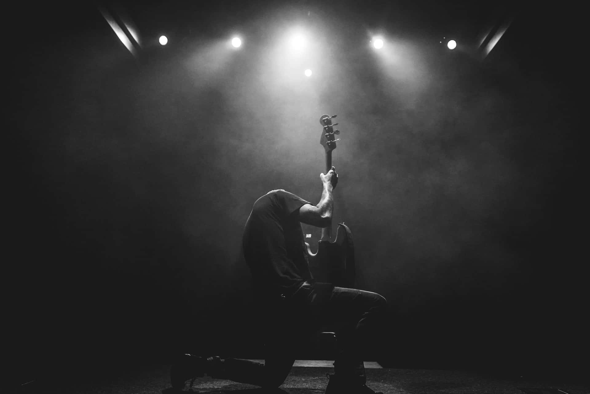 Solitary Guitarist On Stage.jpg Wallpaper