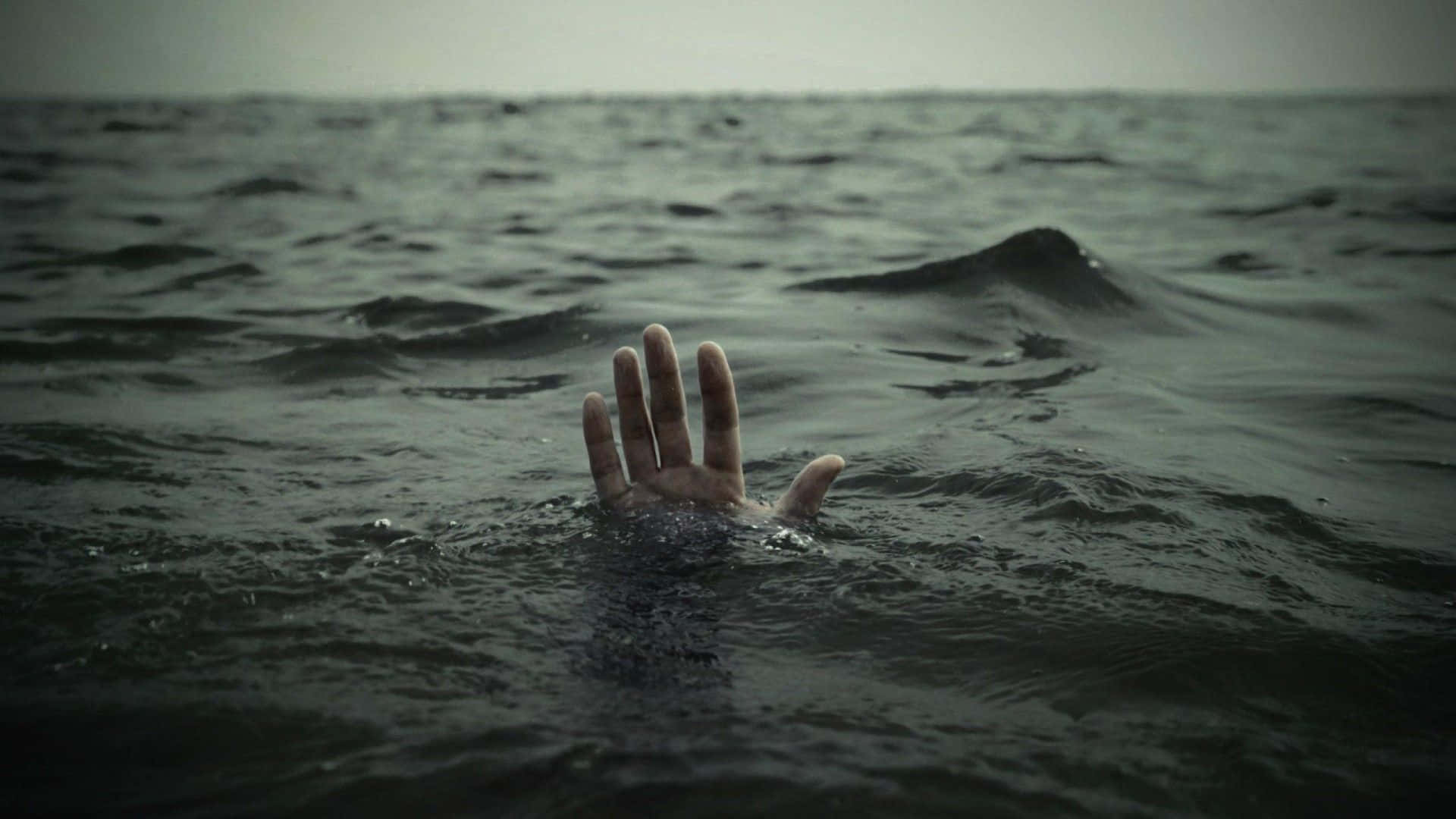 Solitary Hand Drowning Wallpaper
