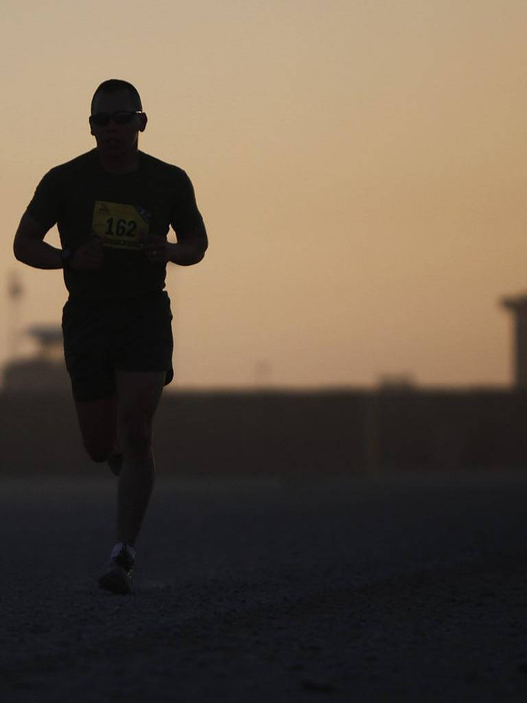 Solo Man Athlete In Marathon