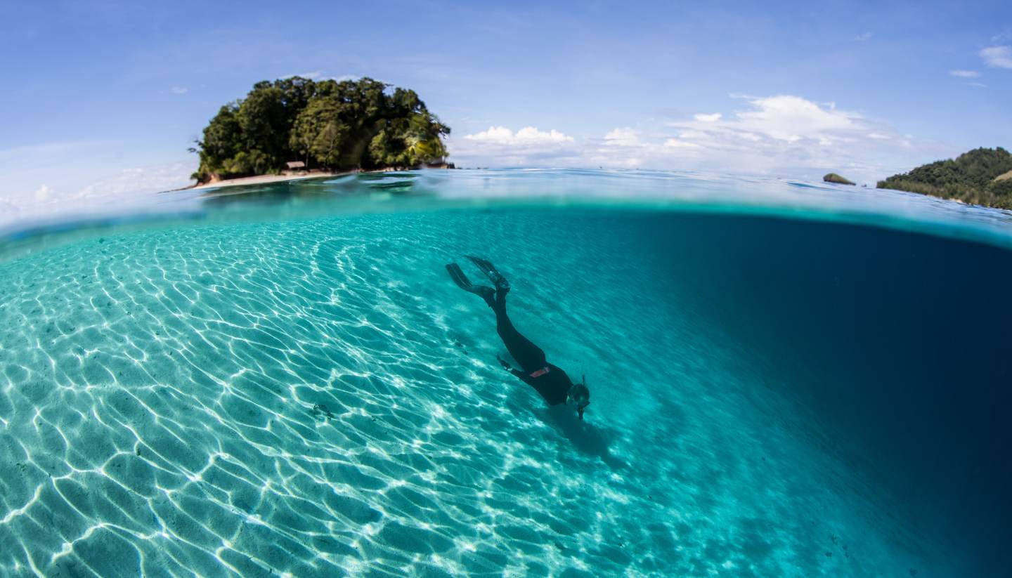 Solomon Islands With Person Swimming Wallpaper