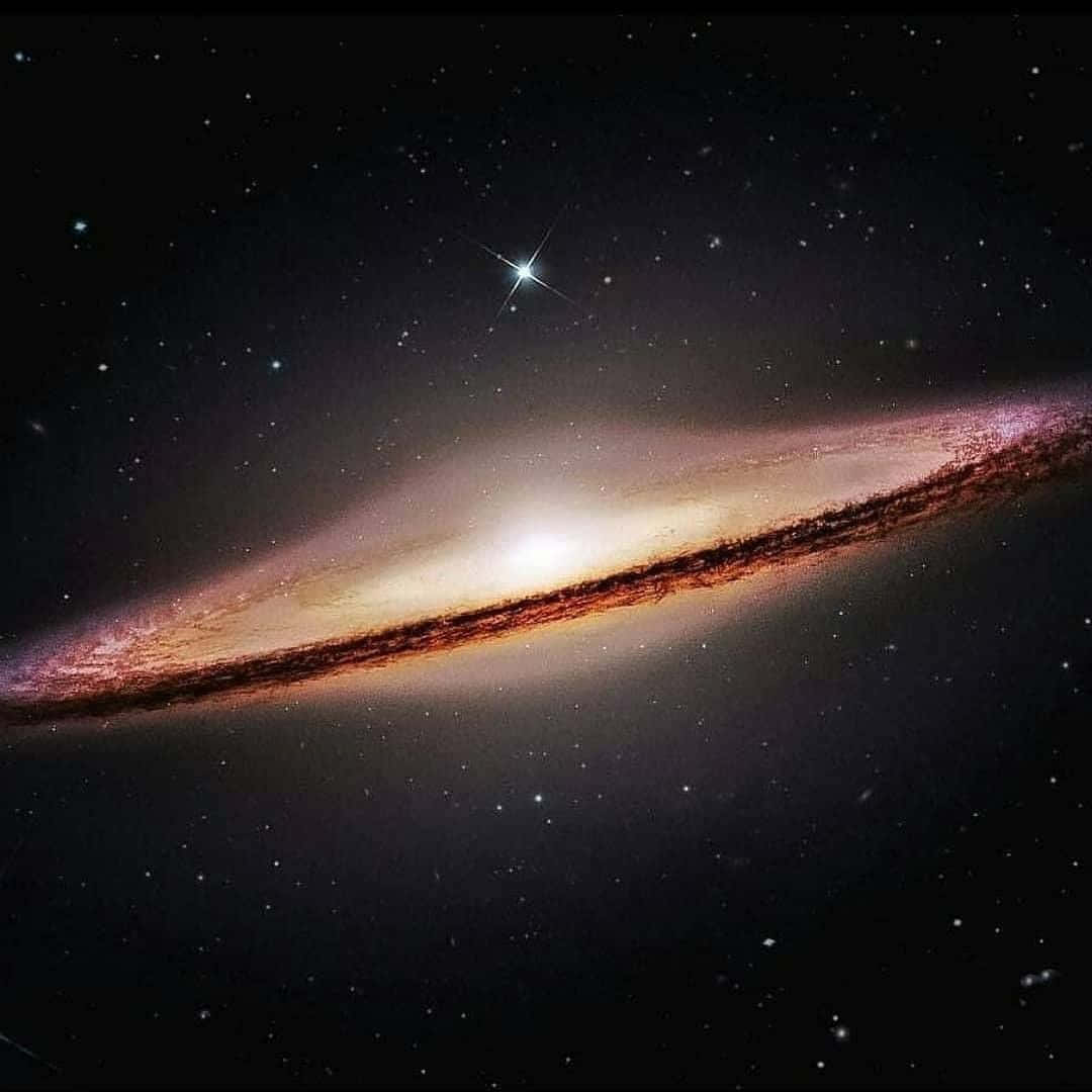 Stunning Image of the Sombrero Galaxy in the Night Sky Wallpaper