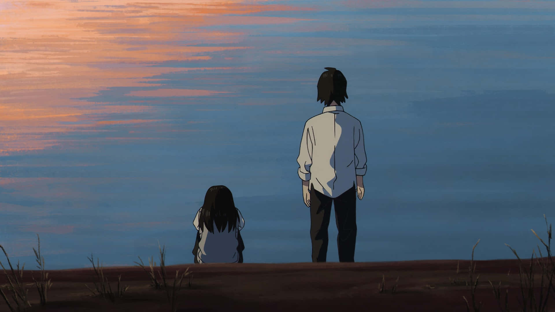A Boy And Girl Standing On A Hill Looking At The Water
