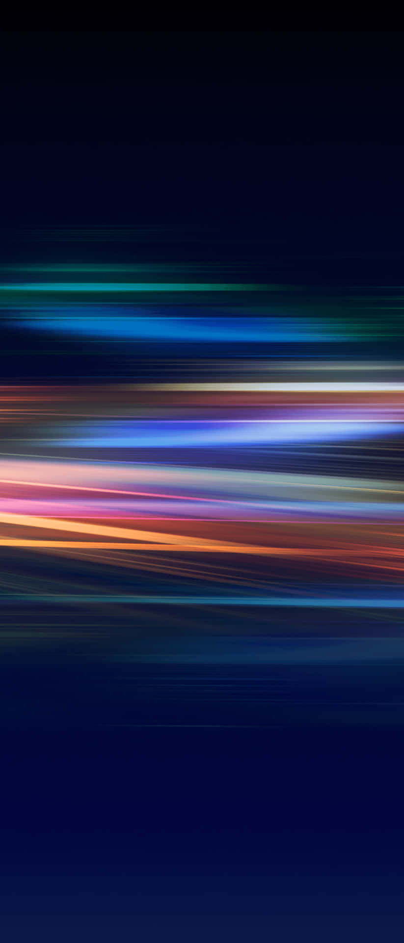 A Blurred Background With Colorful Lights Wallpaper