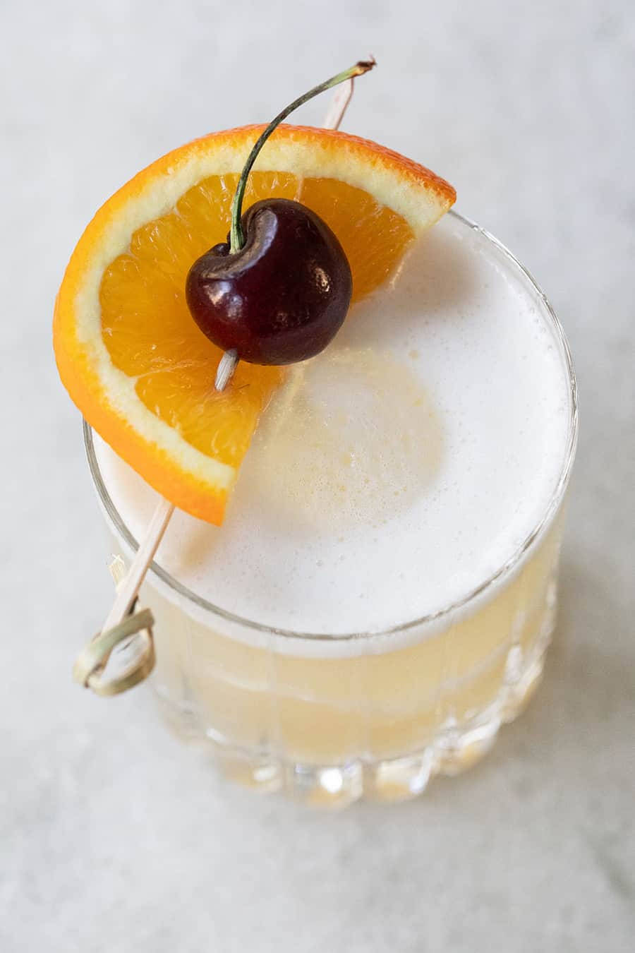 Sour Cocktail With Orange And Cherry Wallpaper