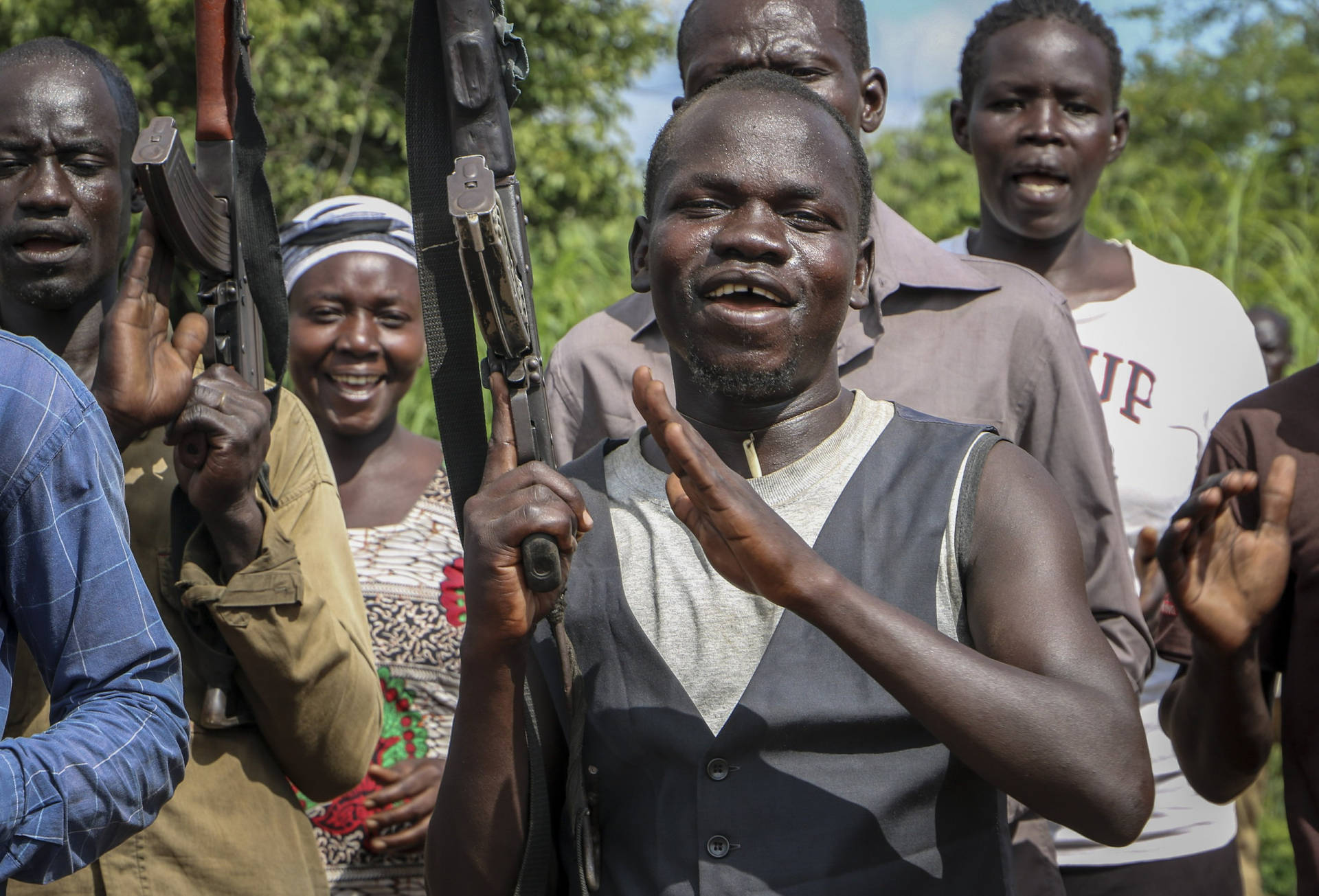 South Sudan Happy Holding Guns Wallpaper