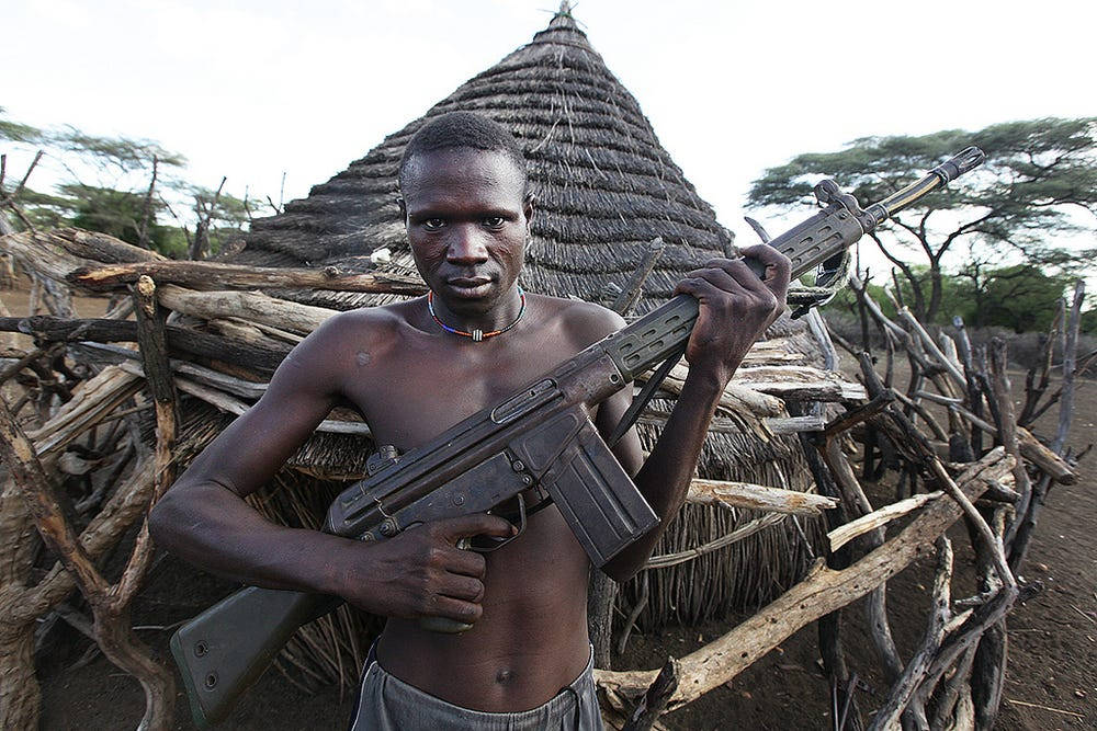 South Sudan Man Holding Assault Rifle Wallpaper