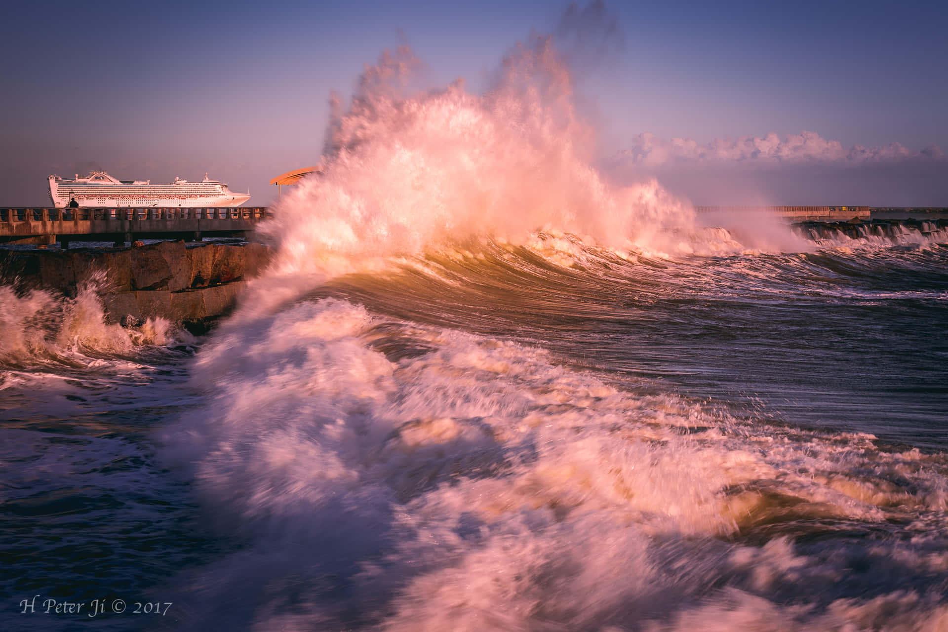 A Large Wave Crashing Into The Shore Wallpaper