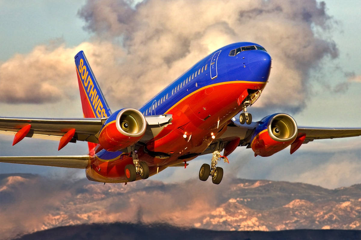 Aviónazul Y Naranja De Southwest Airlines. Fondo de pantalla