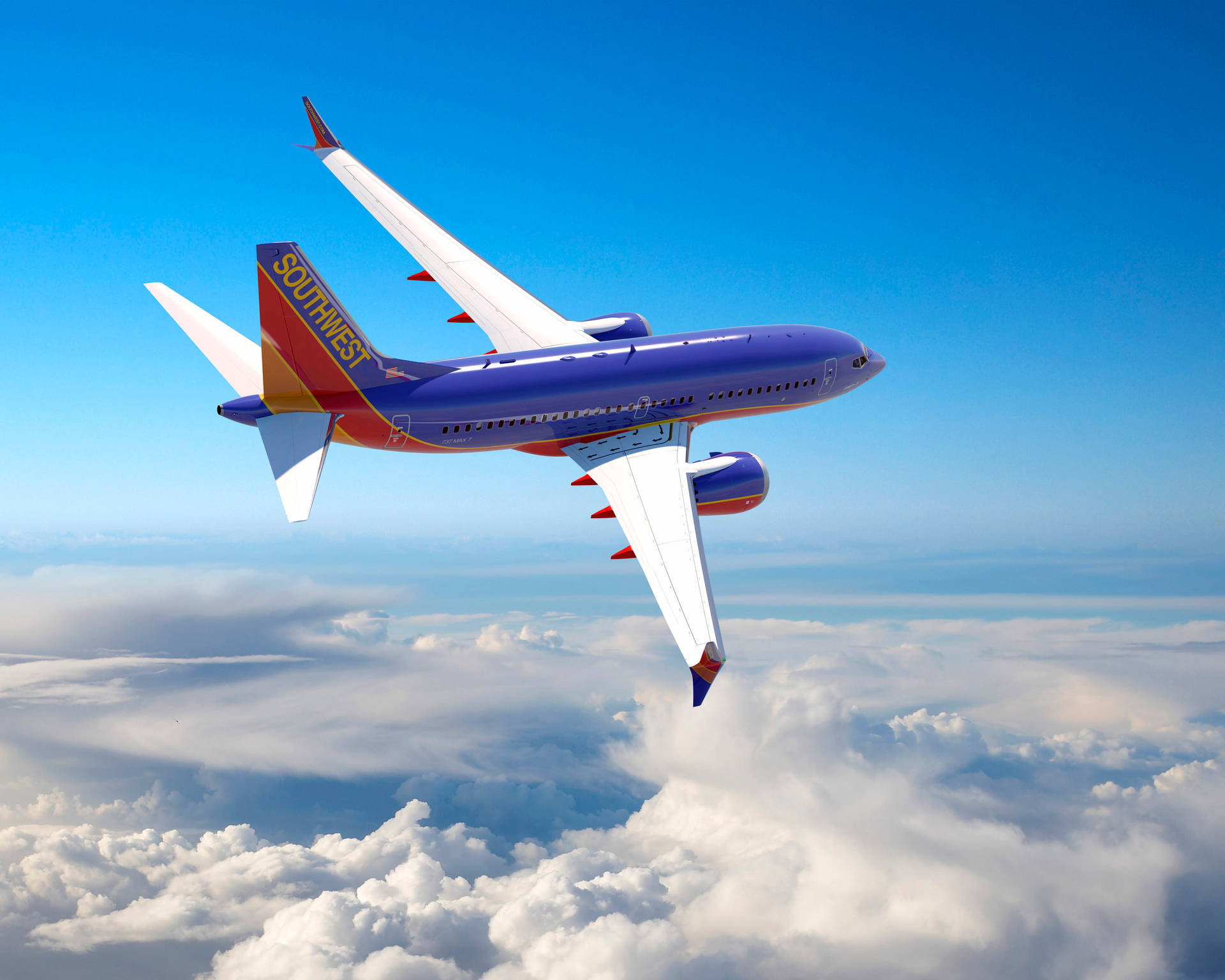 Southwest Airlines Plane Above The Clouds Background
