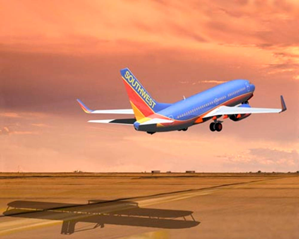 Aviónde Southwest Airlines Despegando. Fondo de pantalla