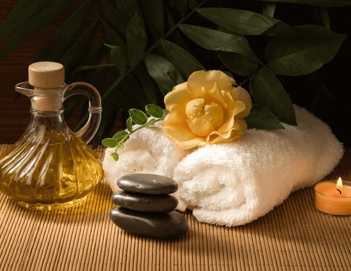 Spa Background Massage Oil White Towels And A Lit Candle