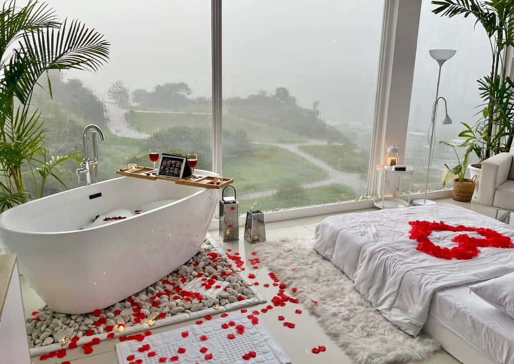 A Bedroom With A Bathtub And Flowers On The Bed