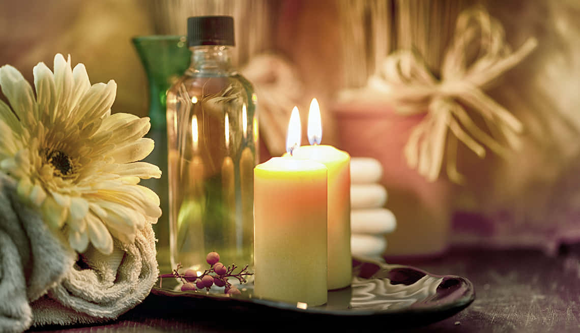 Spa Two Lit Candles And Oil Picture