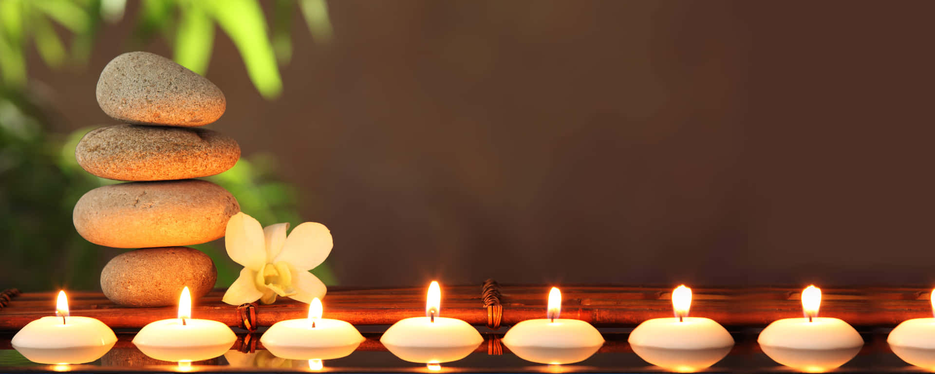 Spa Lit Candles And Gray Stones Picture