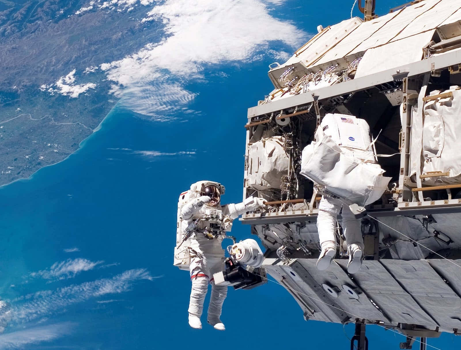 Astronaut in Space Exploring the Cosmos Wallpaper