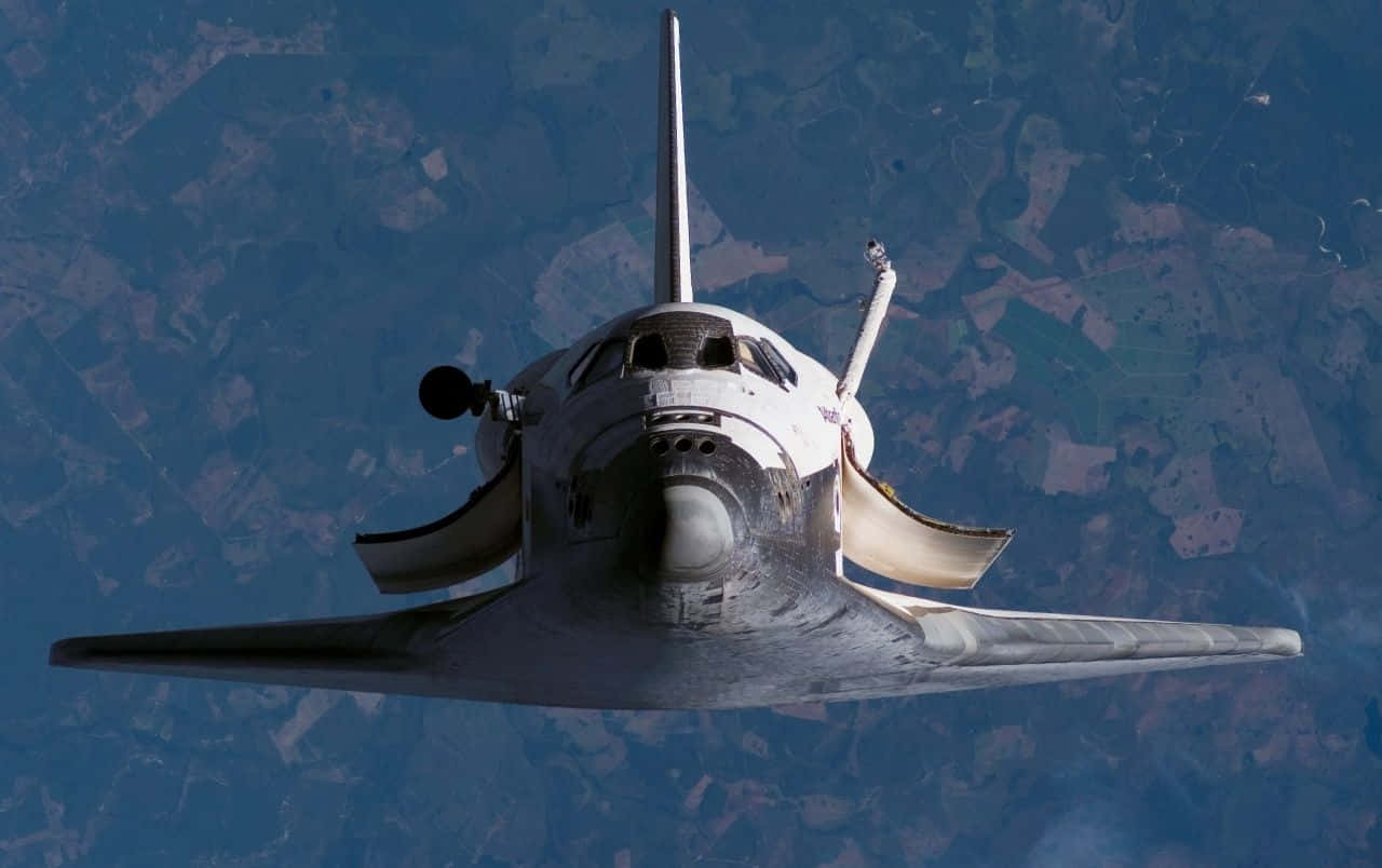 Derspace Shuttle In Der Erdumlaufbahn Wallpaper
