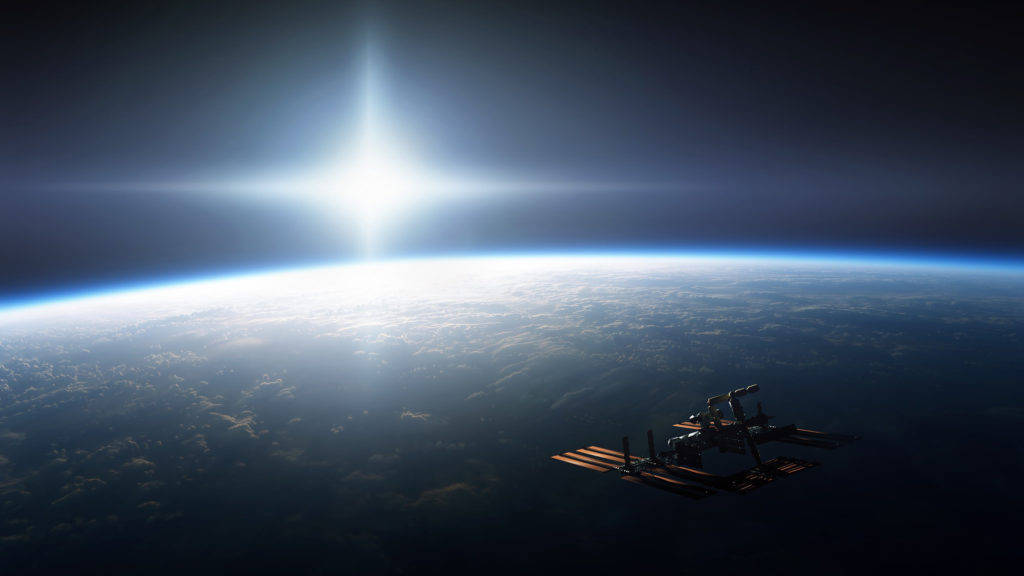 Estaciónespacial Orbitando El Espacio En Pc Fondo de pantalla