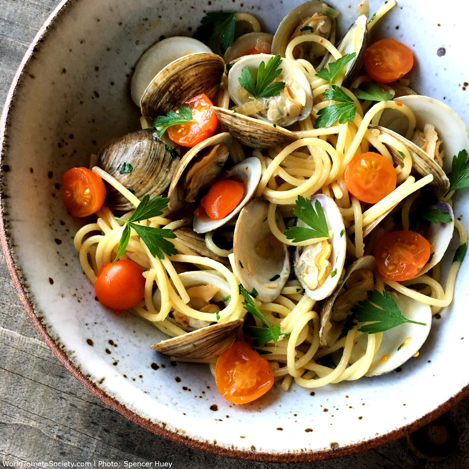Enjoy the rich blend of fresh ingredients in our Spaghetti Alla Vongole with Cherry Tomatoes. Wallpaper