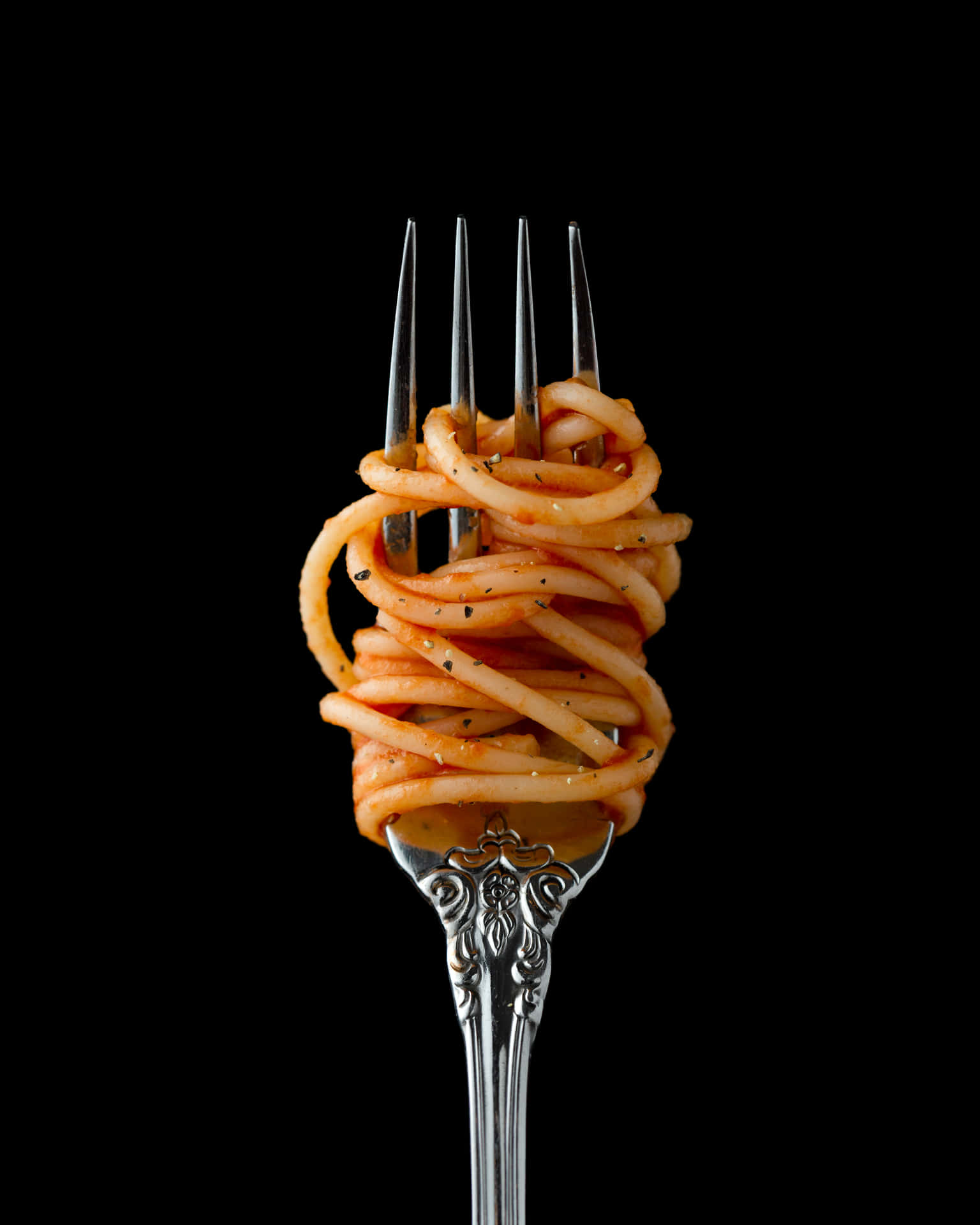 En gaffel med spaghetti på den Wallpaper