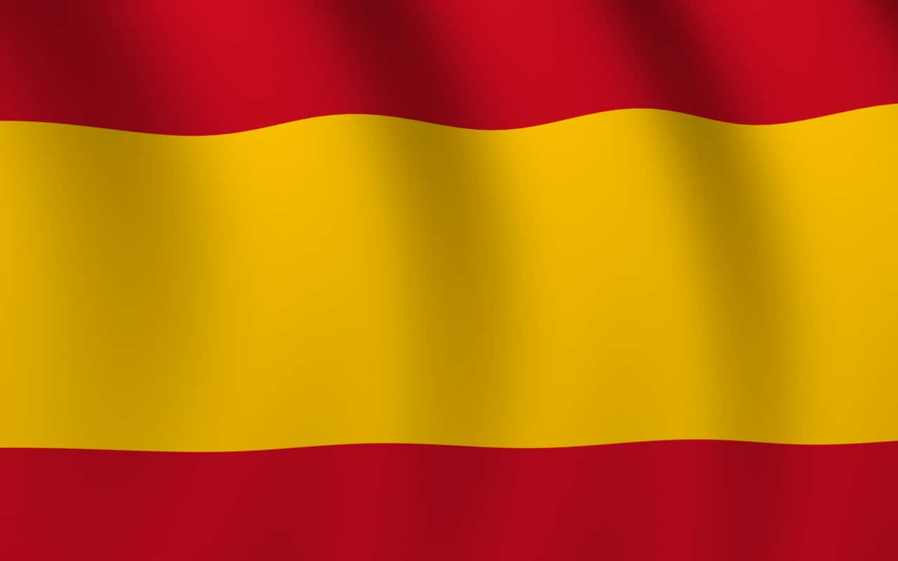 The Flag Of Spain Waving In The Wind