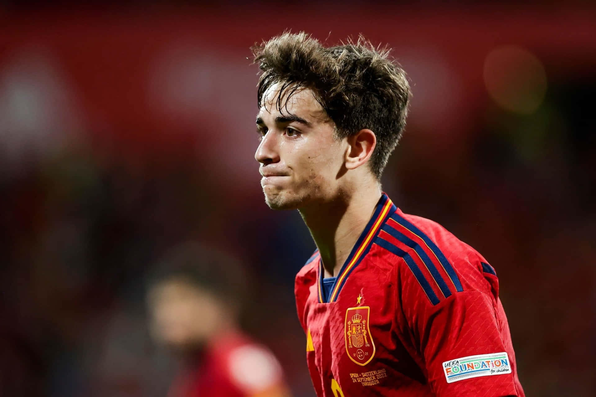 Spanish Footballer Gavi In Red Jersey Wallpaper