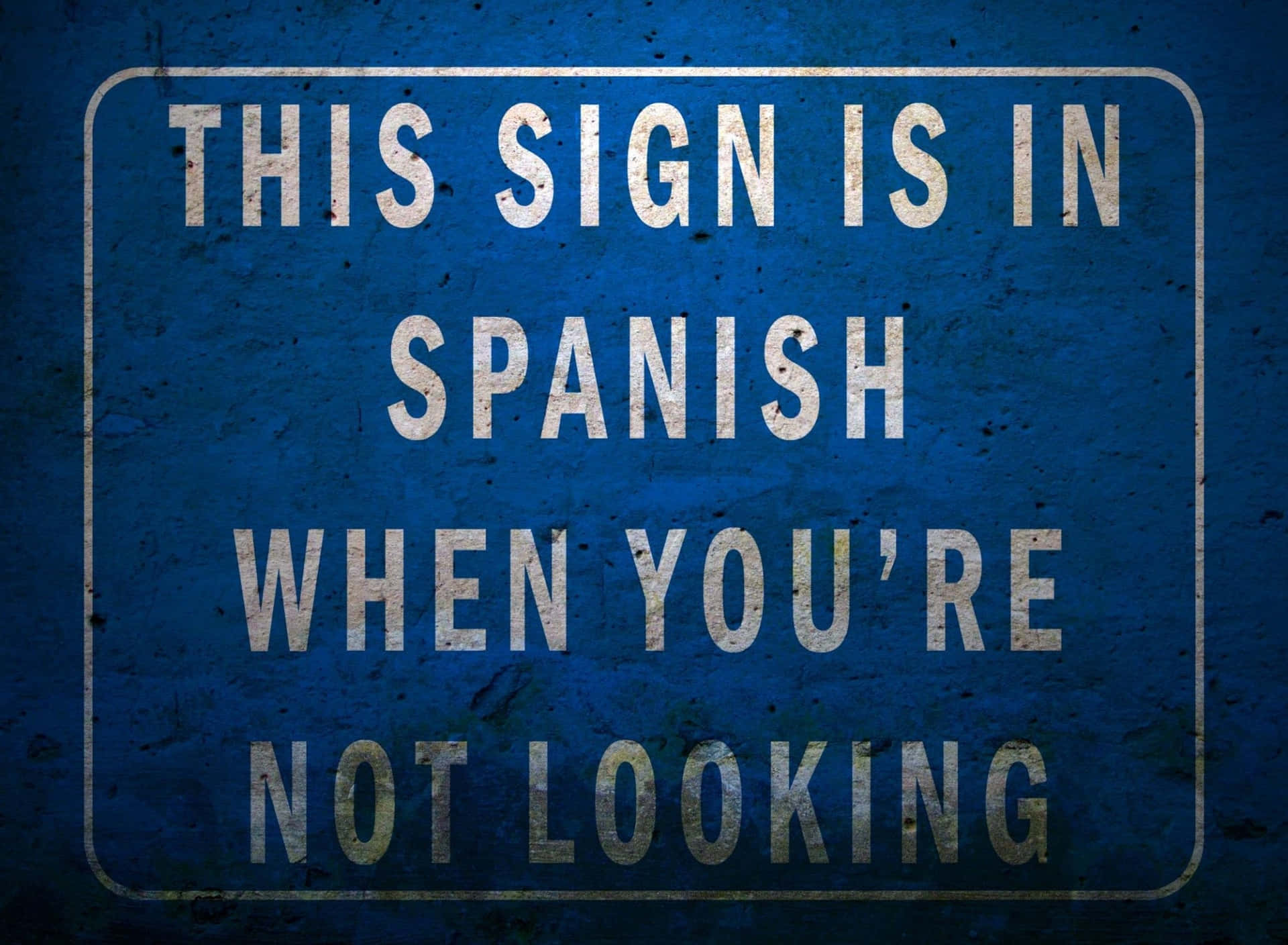 This Sign Is In Spanish When You're Not Looking Wallpaper