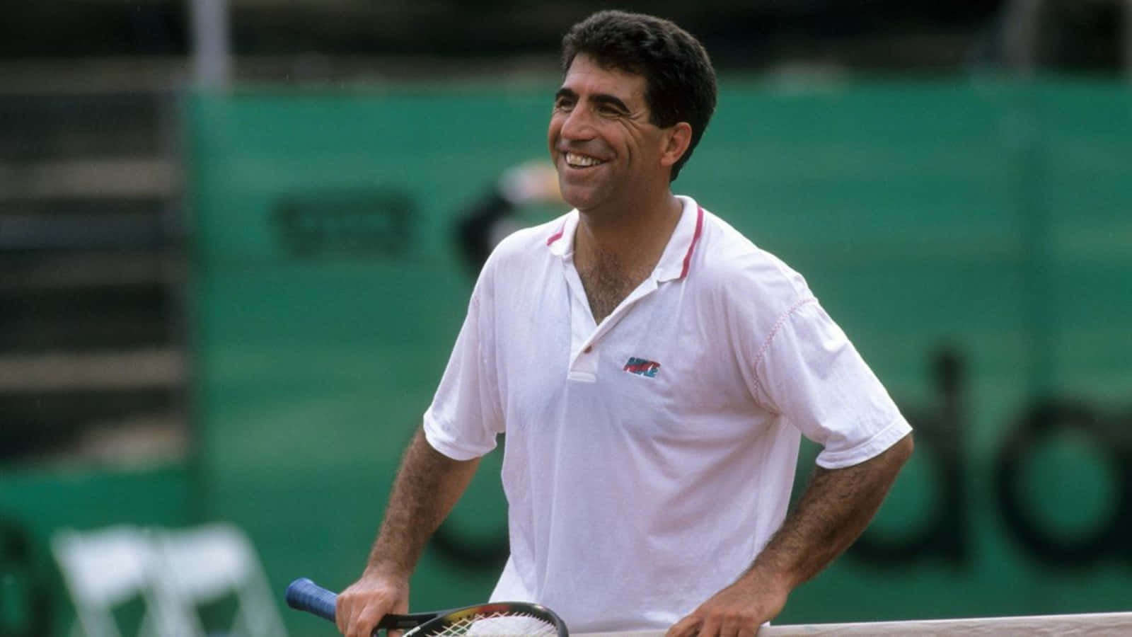 Spanish Tennis Legend Manuel Orantes in Action Wallpaper