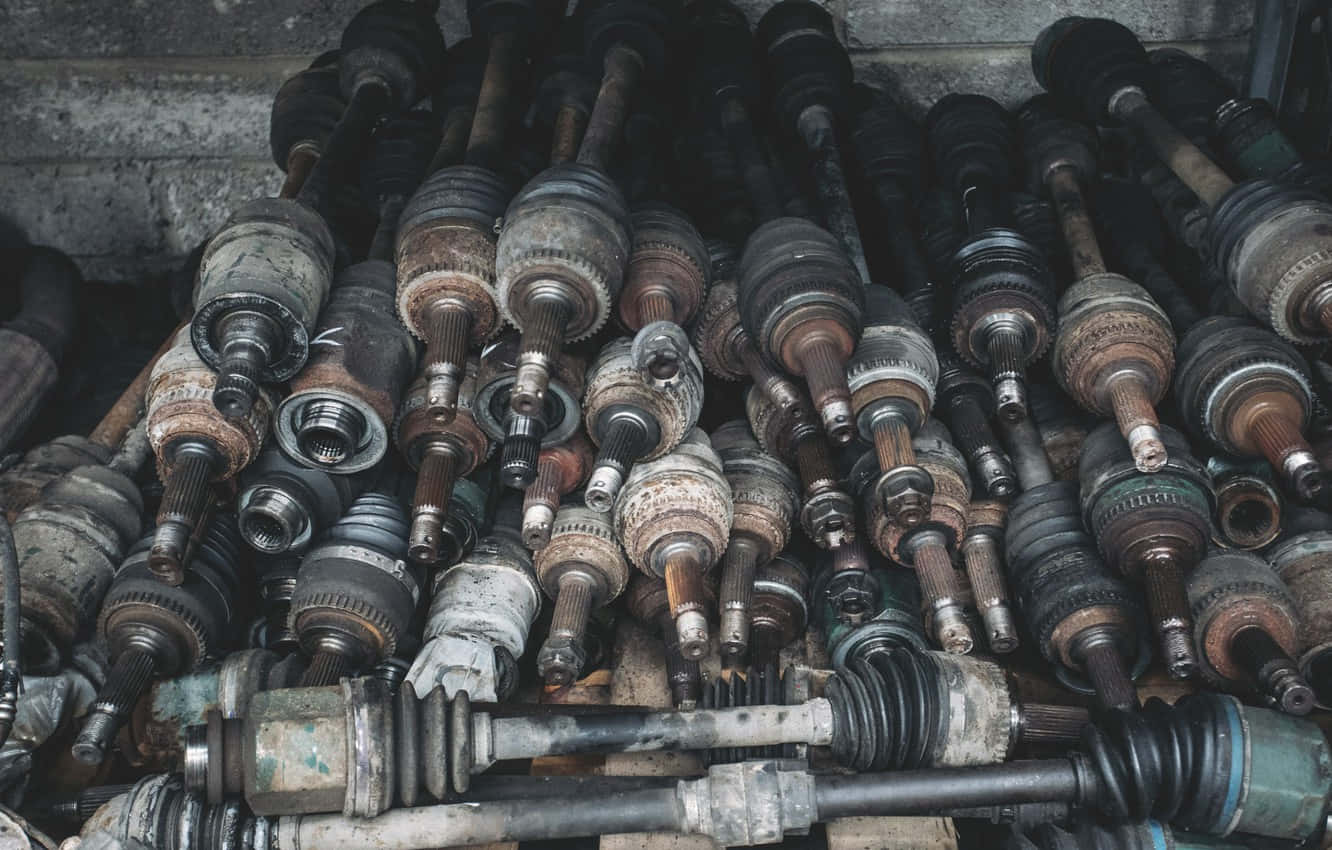 A Pile Of Old Parts In A Garage Wallpaper
