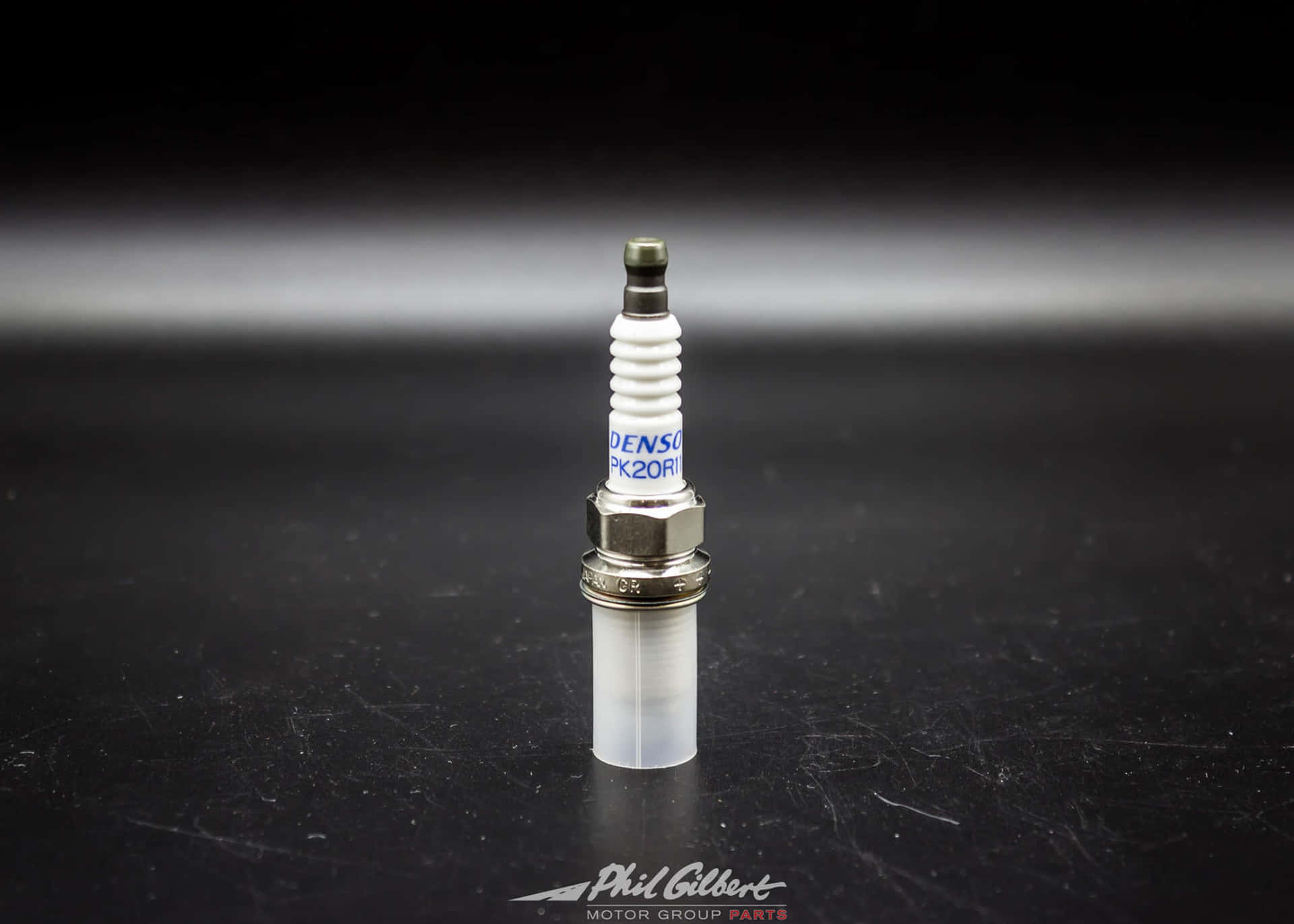 "Sparks of Innovation - A Close-Up Look at a Spark Plug" Wallpaper
